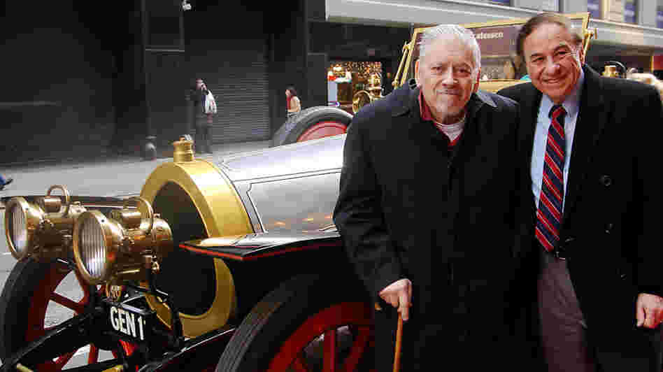 Composer/lyricist Robert Sherman (left) and his brother Richard stand next to the car used in the 1968 film Chitty Chitty Bang Bang. The brothers wrote the songs for the movie, as well as a musical version that began running in 2002.