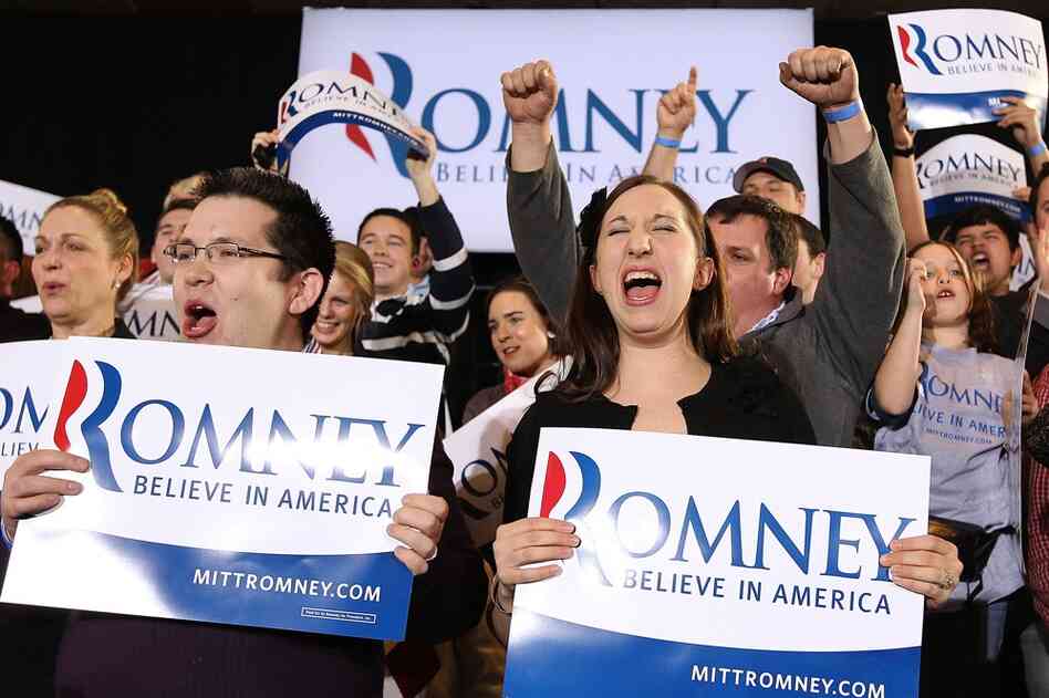 Romney supporters celebrate during a primary night gathering on Tuesday in Boston. 