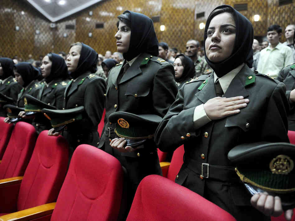 Afghan female cadets attend their graduation ceremony at the Military Training Center in Kabul, the Afghan capital, May 19. Some women say they joined the security forces in order to serve their country, but many say it's because the pay is better than working as a maid or teacher.