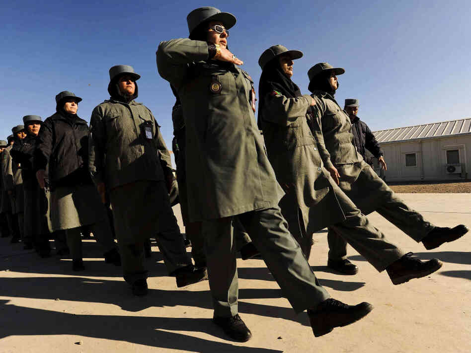 Afghan female police officers march at the Police Training Center on the outskirts of Herat province in western Afghanistan on Dec. 8. 