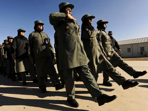 Afghan female police officers march at the Police Training Center on the outskirts of Herat province in western Afghanistan on Dec. 8. Afghan female police officers march at the Police Training Center on the outskirts of Herat province in western Afghanistan on Dec. 8.