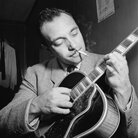 Django Reinhardt with his instrument. Django Reinhardt with his instrument.