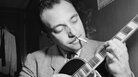 Django Reinhardt with his instrument. Django Reinhardt with his instrument.