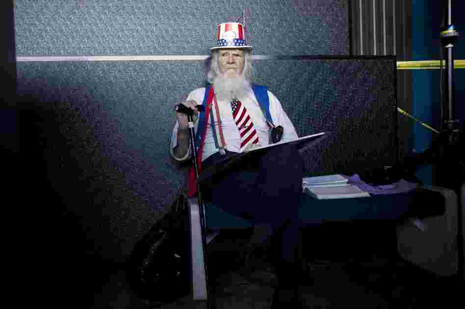 William House waits for Newt Gingrich to arrive during a campaign stop at the U.S. Space and Rocket Center in Huntsville, Ala. 