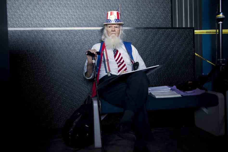 William House waits for Newt Gingrich to arrive during a campaign stop at the U.S. Space and Rocket Center in Huntsville, Ala. 