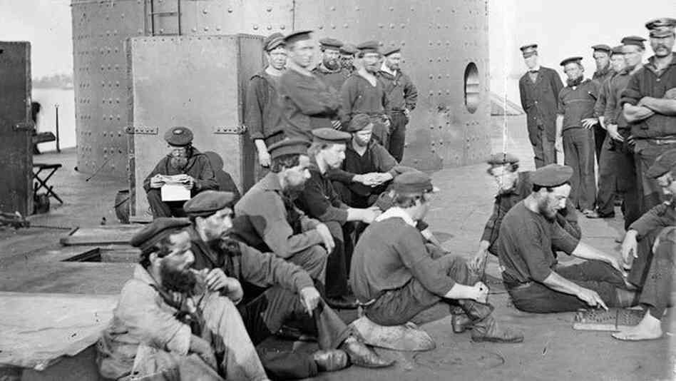 Crewmen of the USS Monitor pose on the deck of their ironclad ship in July 1862. Robert Williams, standing at the far right with his arms crossed, is a candidate for the older sailor whose remains were discovered inside the wreck's gun turret. Crewmen of the USS Monitor pose on the deck of their ironclad ship in July 1862. Robert Williams, standing at the far right with his arms crossed, is a candidate for the older sailor whose remains were discovered inside the wreck's gun turret.