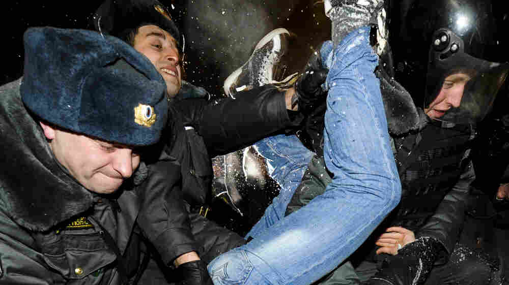 Police officers detain one of the protesters at Moscow's Pushkin Square on Monday. The demonstrators gathered to protest Vladimir Putin's win in Sunday's presidential election. Police officers detain one of the protesters at Moscow's Pushkin Square on Monday. The demonstrators gathered to protest Vladimir Putin's win in Sunday's presidential election.