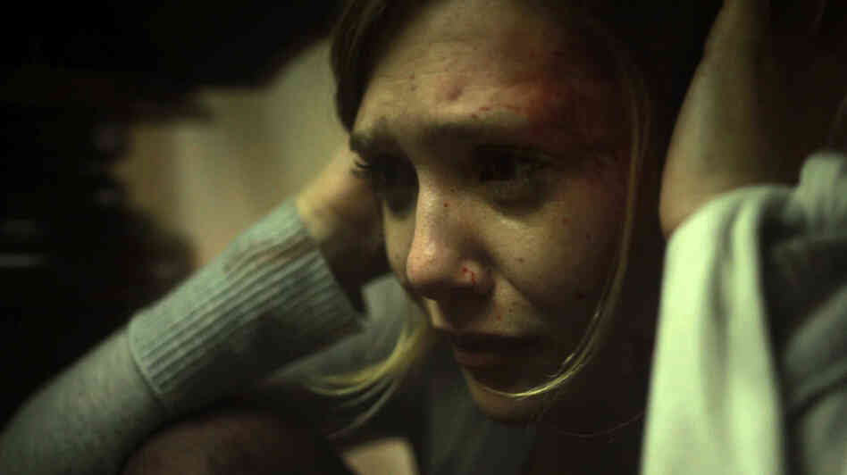 While visiting a now-dilapidated lake house where she spent time as a child, Sarah (Elizabeth Olsen) is increasingly unnerved by terrors unseen — by her and by the camera. While visiting a now-dilapidated lake house where she spent time as a child, Sarah (Elizabeth Olsen) is increasingly unnerved by terrors unseen — by her and by the camera.