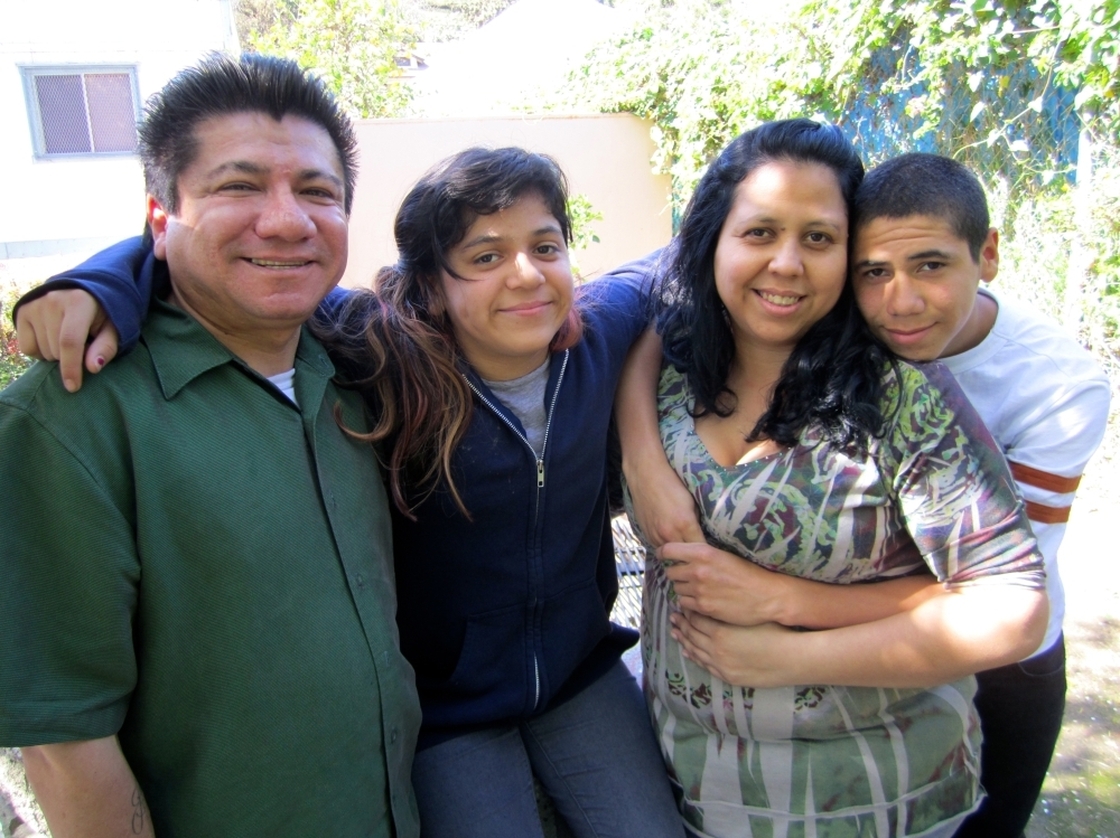 April Casanova-Rios (second from right) visits the school health center at Abraham Lincoln High School in Los Angeles with her family. Her son, Isaiah Casanova (to her right), is a sophomore at the school.