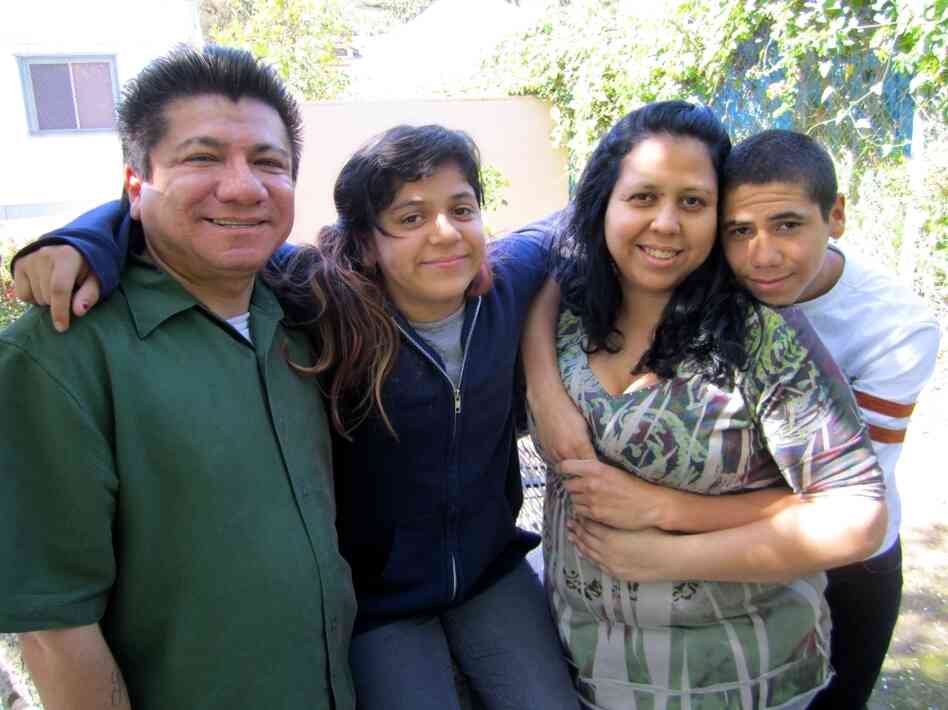 April Casanova-Rios (second from right) visits the school health center at Abraham Lincoln High School in Los Angeles with her family. Her son, Isaiah Casanova (to her right), is a sophomore at the school.