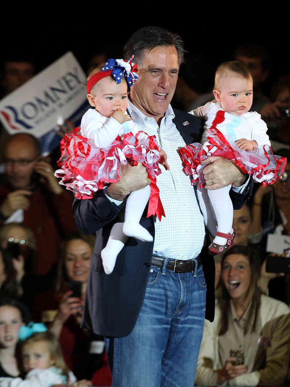 Mitt Romney holds babies during a campaign rally Sunday in Knoxville, Tenn. On Tuesday, Romney finished a distant second to Rick Santorum in the state.