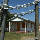 An abandoned home sits behind a padlocked gate in Stockton, Calif., in 2008. An abandoned home sits behind a padlocked gate in Stockton, Calif., in 2008.