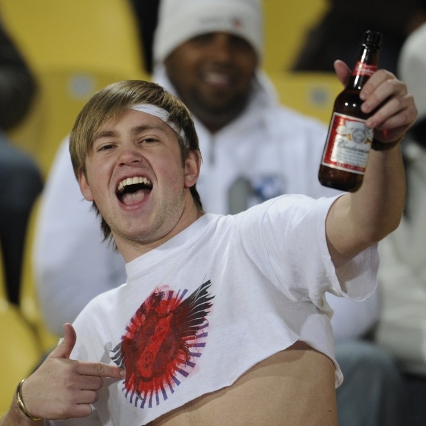 A soccer fan drinks beer before a 2010 World Cup soccer game in South Africa. Budweiser has been the official beer of the FIFA World Cup since 1986 -- a role at odds with 2014 World Cup host Brazil's ban on beer at games.