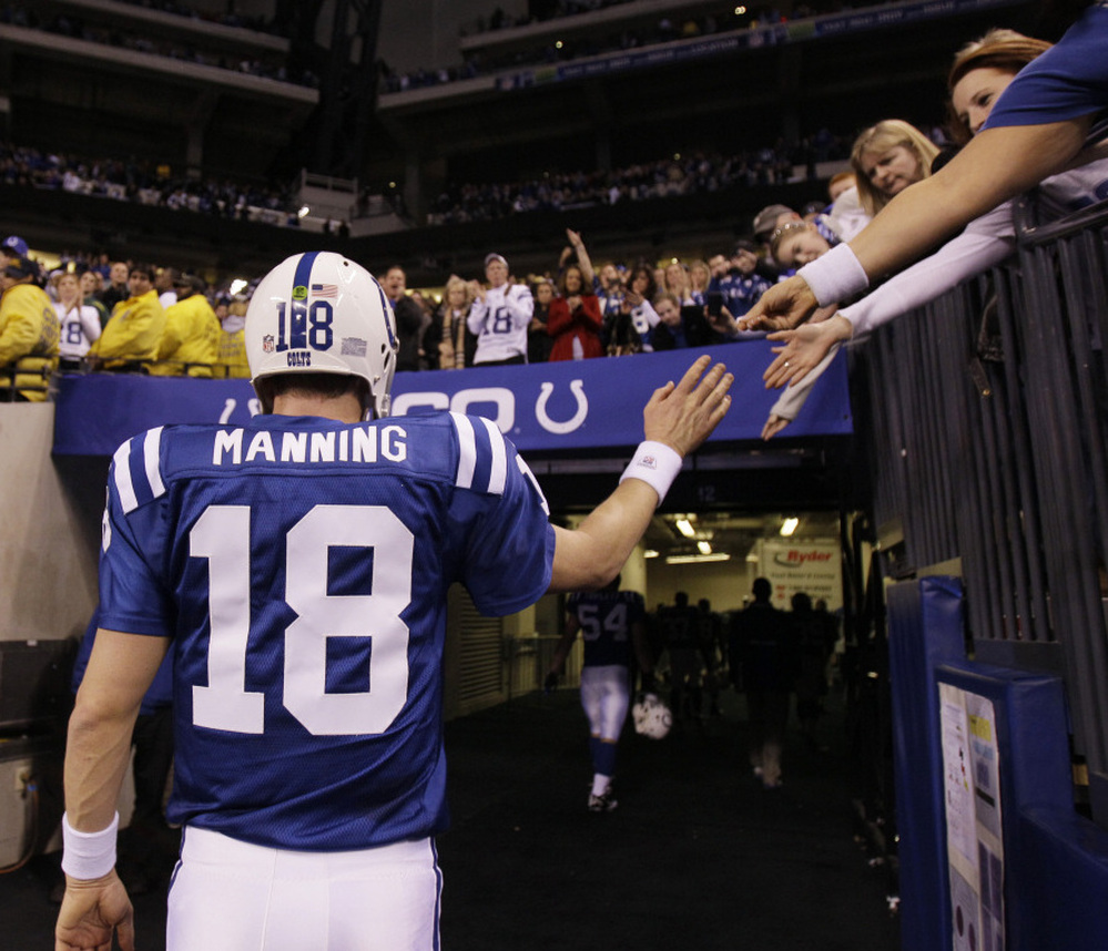 Indianapolis Colts quarterback Peyton Manning walks off the field after the Colts lost to the New York Jets, 17-16, in an AFC wild card game in January.