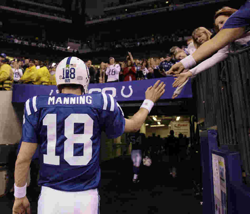 Indianapolis Colts quarterback Peyton Manning walks off the field after the Colts lost to the New York Jets, 17-16, in an AFC wild card game in January.