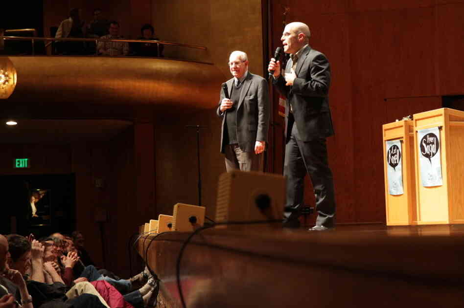 Carl and Peter talk to the audience. Carl and Peter talk to the audience.