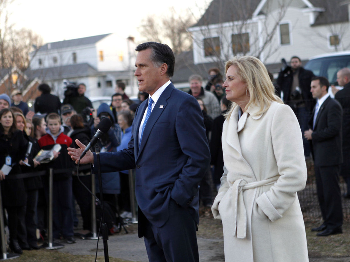 Mitt Romney, with wife Ann, talks to reporters after voting in the Massachusetts primary in Belmont, Mass, Tuesday, March 6, 2012.