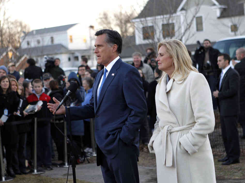Mitt Romney, with wife Ann, talks to reporters after voting in the Massachusetts primary in Belmont, Mass, Tuesday, March 6, 2012.