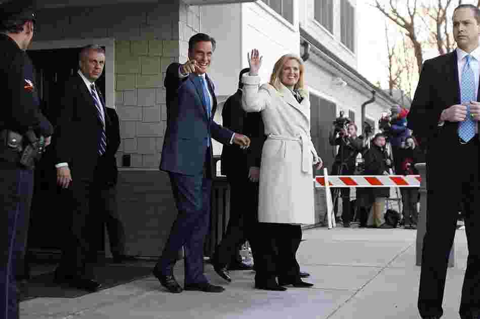Romney and his wife, Ann, wave to supporters after voting in the Massachusetts primary in Belmont, Mass. 