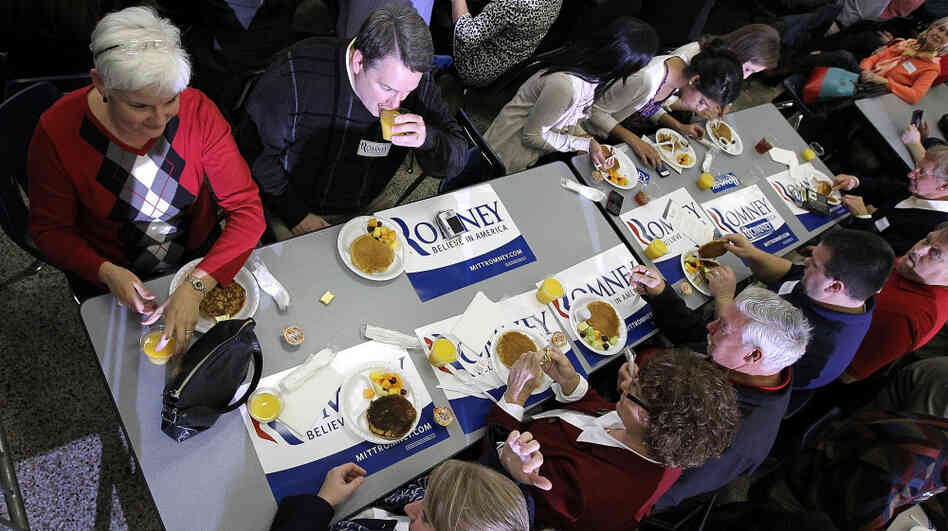 Mitt Romney supporters share a pancake brunch in Snellville, Ga., on Sunday. Rival Newt Gingrich won the state on Super Tuesday, by about 22 percentage points. Mitt Romney supporters share a pancake brunch in Snellville, Ga., on Sunday. Rival Newt Gingrich won the state on Super Tuesday, by about 22 percentage points.