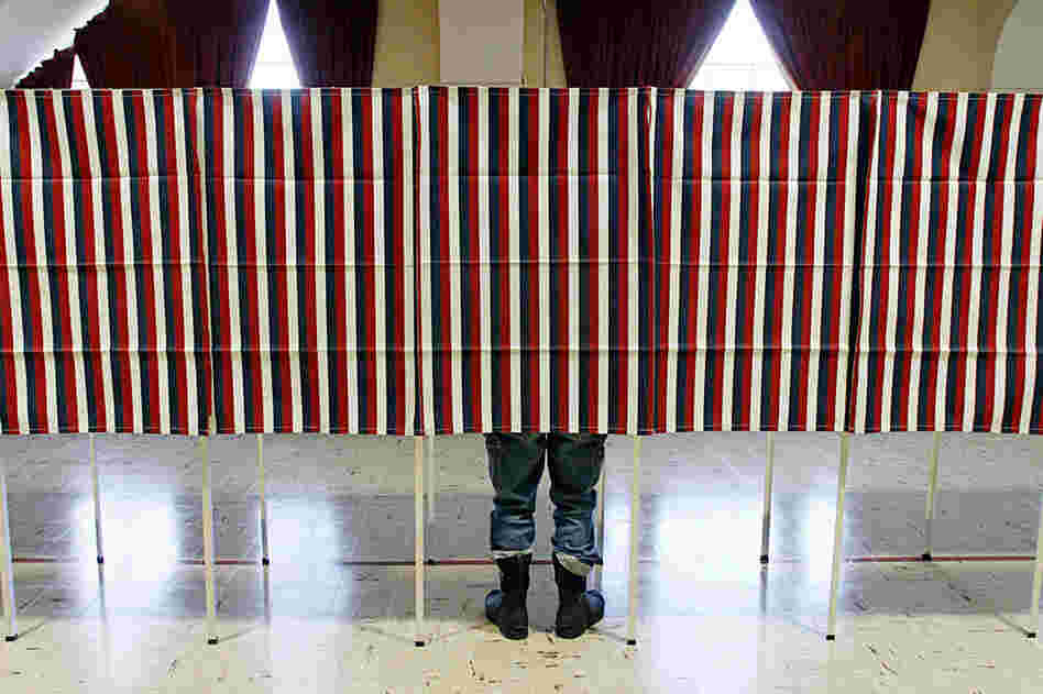 A voter casts his ballot in Montpelier, Vt. Romney is also expected to do well in the state, which borders Massachusetts. 
