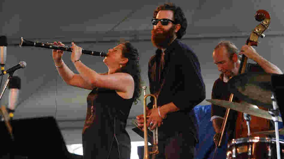 Anat Cohen (left) performs with Avishai Cohen (center) at the Newport Jazz Festival. 