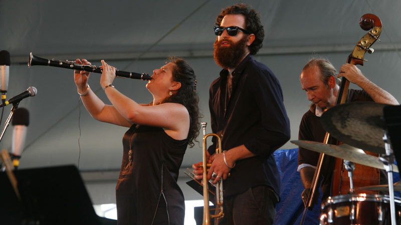 Anat Cohen (left) performs with Avishai Cohen (center) at the Newport Jazz Festival. 