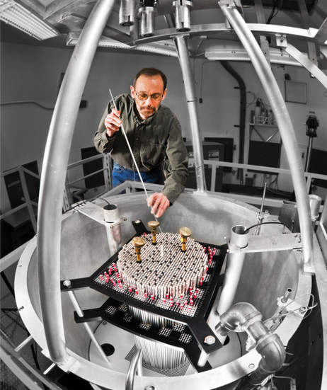 Sandia scientist John Ford places fuel rods in the Seven Percent Critical Experiment at the at the Sandia Pulsed Reactor Facility Critical Experiments test reactor - a reactor stripped down to its simplest form. The fuel rod John is holding in this photograph is actually a dummy rod used for practice. Sandia scientist John Ford places fuel rods in the Seven Percent Critical Experiment at the at the Sandia Pulsed Reactor Facility Critical Experiments test reactor - a reactor stripped down to its simplest form. The fuel rod John is holding in this photograph is actually a dummy rod used for practice.