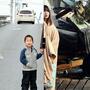 Yuko Sugimoto (right) stands reunited with her 5-year-old son, Raito, on a road in Japan's Miyagi prefecture, 2012. This photo was taken at the same place where she was photographed immediately after the tsunami in March 2011.