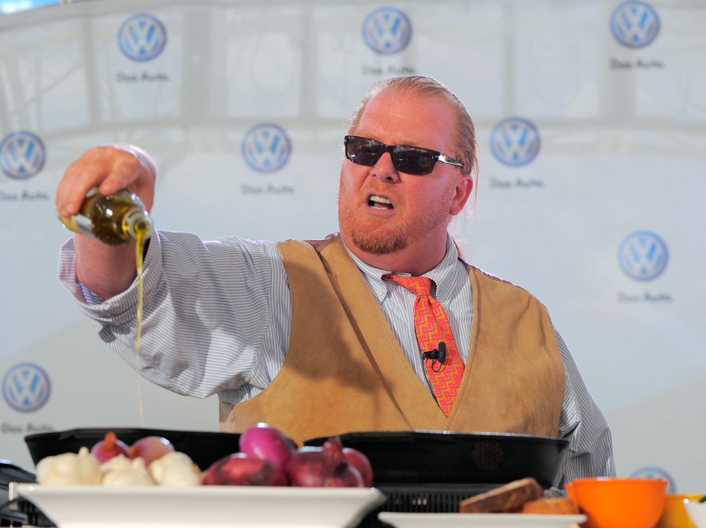 Chef Mario Batali prepares dishes for the crowd at the world premiere of Volkswagen's new Jetta compact sedan in New York City in 2010.