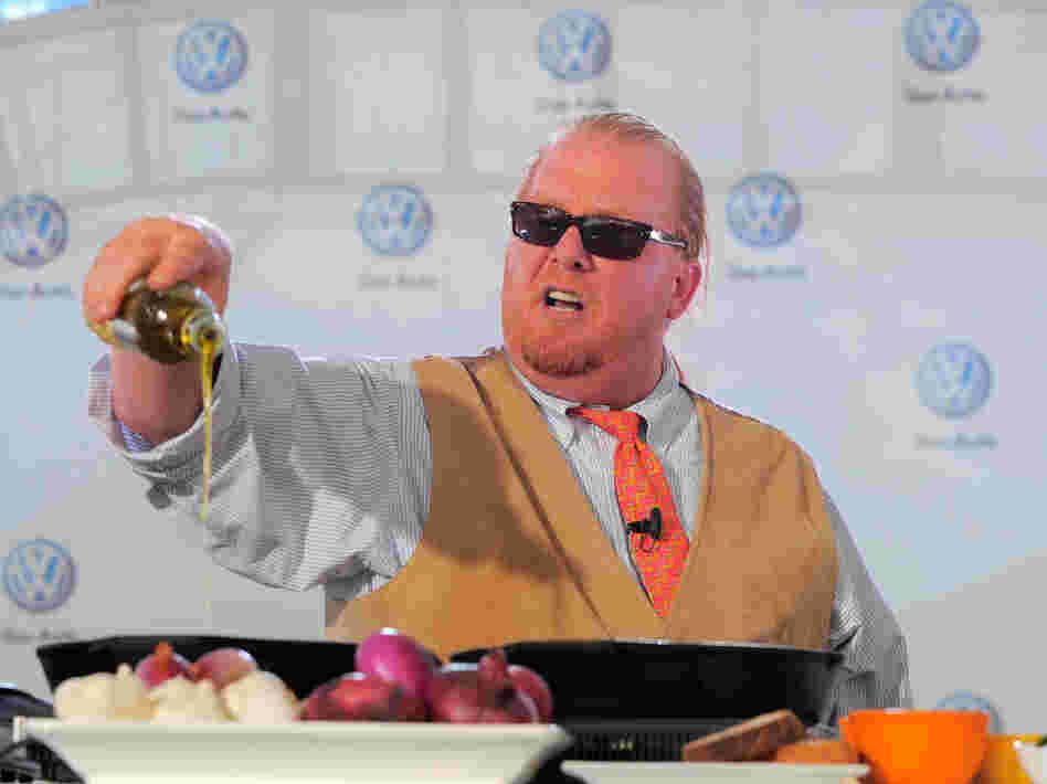 Chef Mario Batali prepares dishes for the crowd at the world premiere of Volkswagen's new Jetta compact sedan in New York City in 2010.