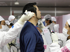 A worker is given a radiation screening as he enters the emergency operation center at Tokyo Electric Power Co.'s tsunami-crippled Fukushima Dai-ichi nuclear power plant on Feb. 20. A worker is given a radiation screening as he enters the emergency operation center at Tokyo Electric Power Co.'s tsunami-crippled Fukushima Dai-ichi nuclear power plant on Feb. 20.