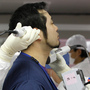 A worker is given a radiation screening as he enters the emergency operation center at Tokyo Electric Power Co.'s tsunami-crippled Fukushima Dai-ichi nuclear power plant on Feb. 20. 