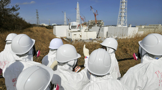 Members of the media, wearing protective suits and masks, visit the tsunami-crippled Fukushima nuclear power station during a press tour, in northeastern Japan's Fukushima prefecture, Feb. 28. Japan is marking the first anniversary of the March 11 tsunami and earthquake, which triggered the worst nuclear accident in the country's history.