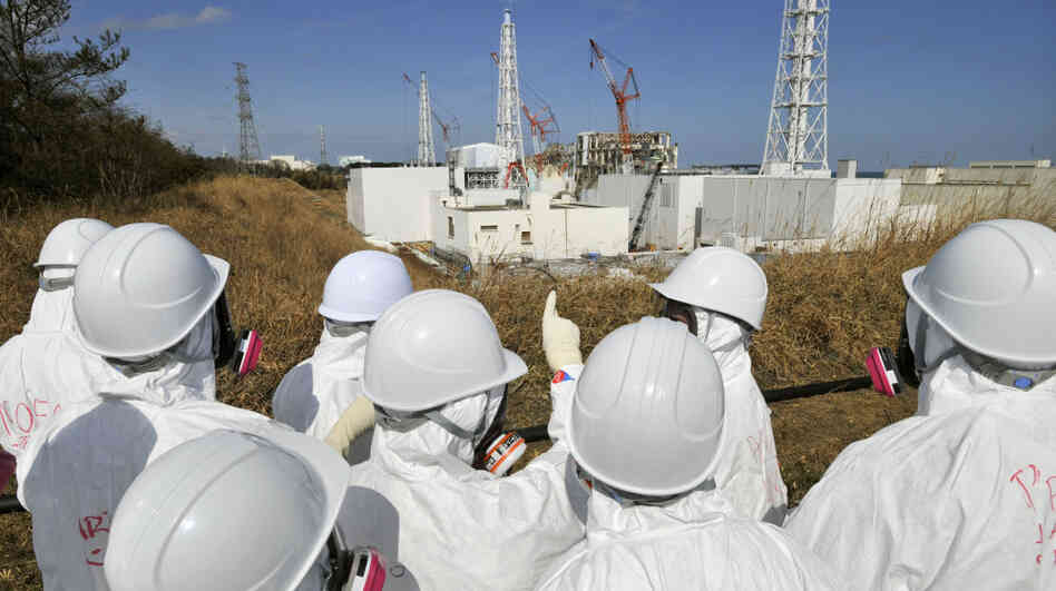 Members of the media, wearing protective suits and masks, visit the tsunami-crippled Fukushima nuclear power station during a press tour, in northeastern Japan's Fukushima prefecture, Feb. 28. Japan is marking the first anniversary of the March 11 tsunami and earthquake, which triggered the worst nuclear accident in the country's history.