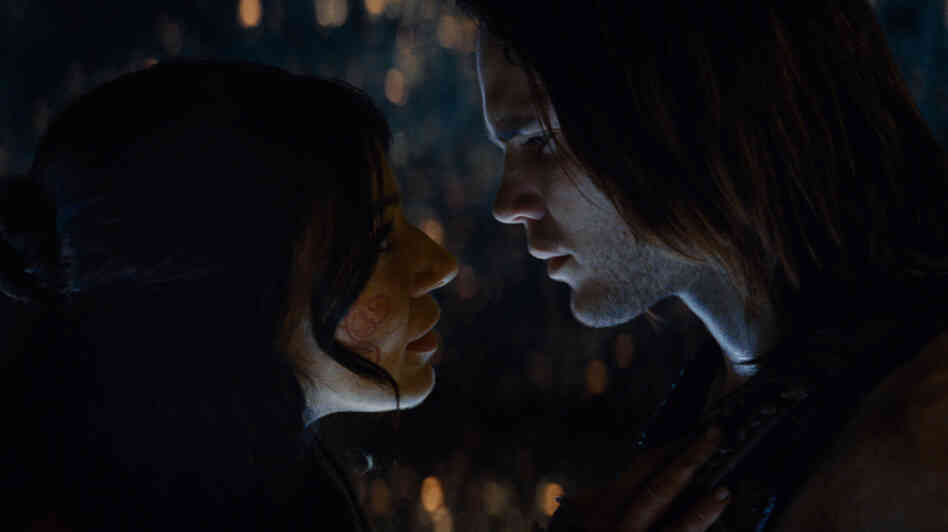 Dejah Thoris (Lynn Collins), warrior and princess of the "Red" Martians, cozies up to earthling John Carter (Taylor Kitsch), a Civil War veteran who gains superhuman strength and agility when he's transported to Mars. Dejah Thoris (Lynn Collins), warrior and princess of the "Red" Martians, cozies up to earthling John Carter (Taylor Kitsch), a Civil War veteran who gains superhuman strength and agility when he's transported to Mars.