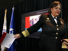U.S. Surgeon General Regina Benjamin totes a copy of a report on the need to reduce children's use of tobacco. U.S. Surgeon General Regina Benjamin totes a copy of a report on the need to reduce children's use of tobacco.