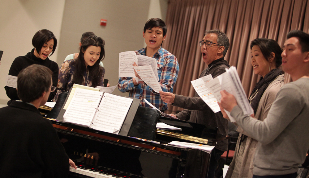 Prepping for a New York City Shinsai benefit, actors Angel Desai (left), Olivia Oguma, Paolo Montalban, Thom Sesma, Cindy Cheung and Johnny Wu rehearse songs from Pacific Overtures in a Lincoln Center studio. 