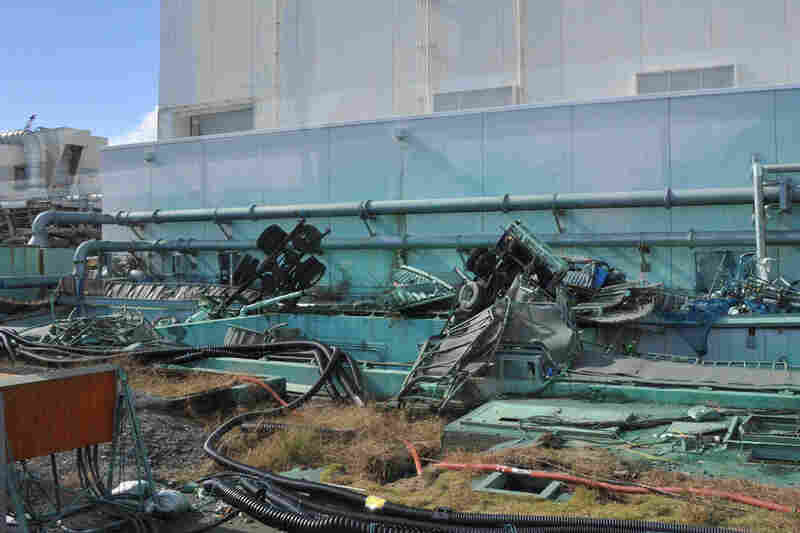 Broken vehicles remain abandoned near a turbine building for months after the water receded. Rubble was virtually untouched before this Nov. 12 photo was taken.