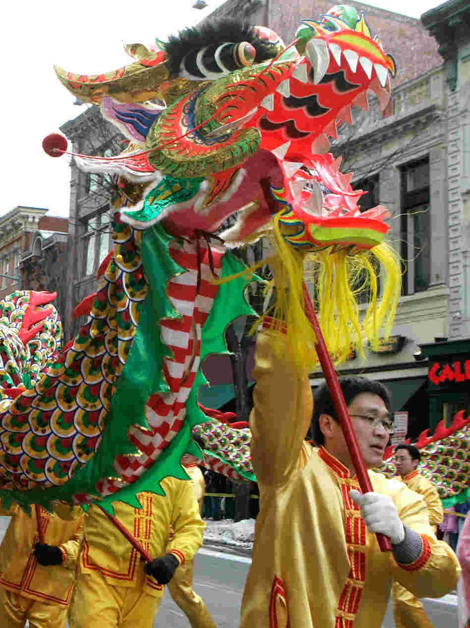 Participants perform a dragon dance during the annual Chinese New Year parade in 2007 in the Chinatown section of Washington, D.C. Participants perform a dragon dance during the annual Chinese New Year parade in 2007 in the Chinatown section of Washington, D.C.