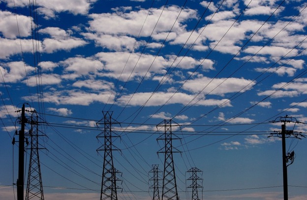 Towers carry electrical lines in San Francisco. The electricity grid is a web of power stations, transformers and transmission lines that span the continent. 