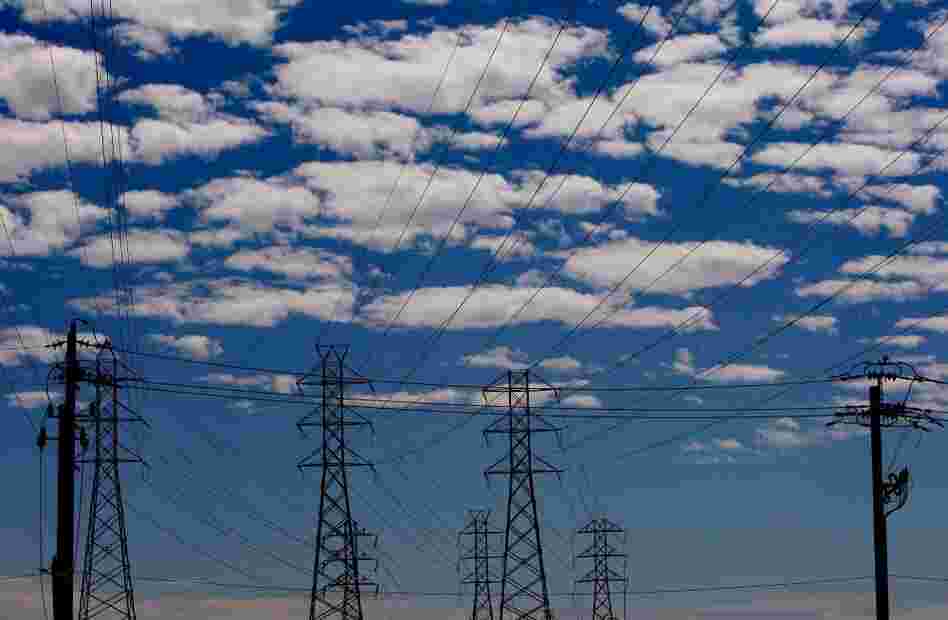 Towers carry electrical lines in San Francisco. The electricity grid is a web of power stations, transformers and transmission lines that span the continent. 