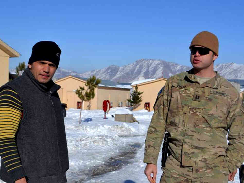 Army Capt. Joe Fritze (right), who trains Afghan police officers in Kabul, works closely with interpreter Gul Agha Shirazi. Fritze says he depends on Shirazi not just to translate, but to warn him if he senses anything suspicious or dangerous. 