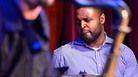 Kendrick Scott, through the crook of John Ellis' saxophone. Kendrick Scott, through the crook of John Ellis' saxophone.