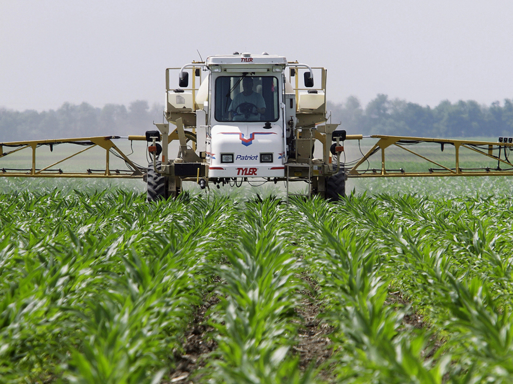 A farmer sprays the weed killer glyphosate across his cornfield in Auburn, Ill. 