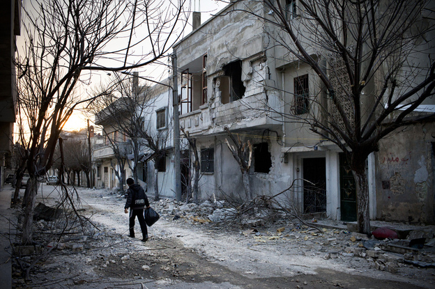 On a street in Baba Amr, the house where Daniels and three other journalists were holed up for days is behind the building at right.