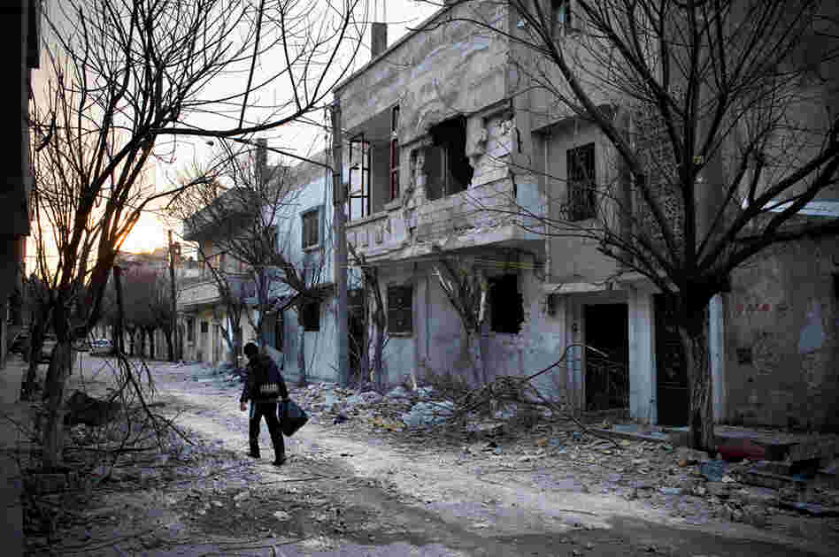 On a street in Baba Amr, the house where Daniels and three other journalists were holed up for days is behind the building at right.