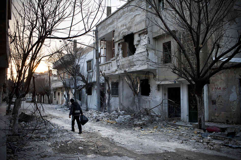 On a street in Baba Amr, the house where Daniels and three other journalists were holed up for days is behind the building at right.