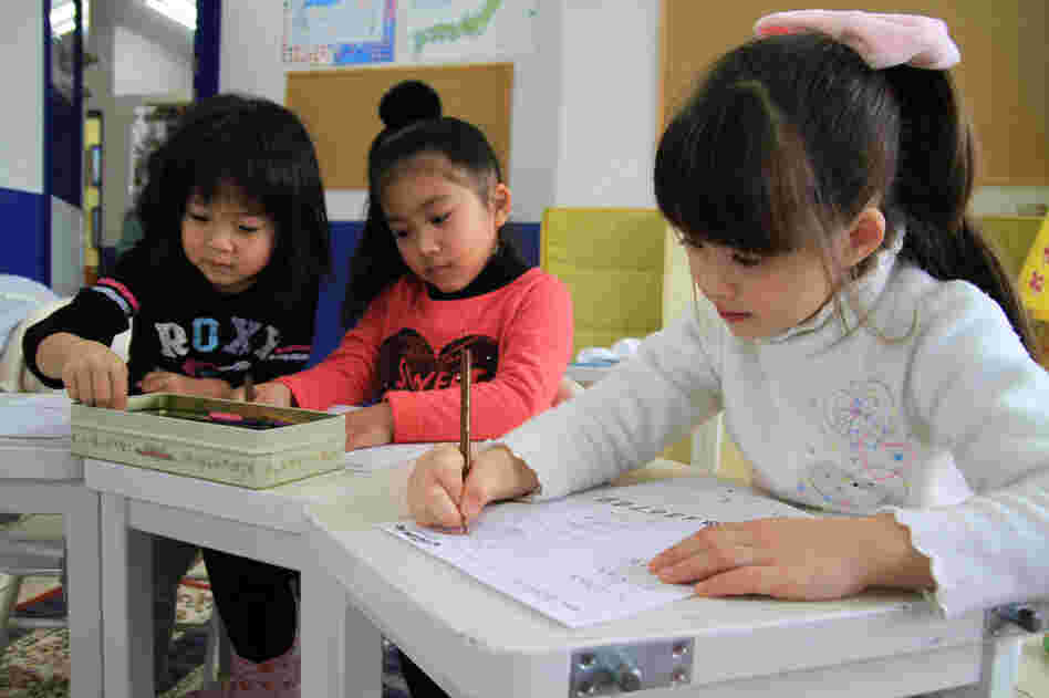 Students draw during art class at Imagine Japan, an English-language school in Sendai City, Japan. Immediately following last year's earthquake and tsunami in northeast Japan, a teacher observed some of the kids drawing faces and bodies with black markers.