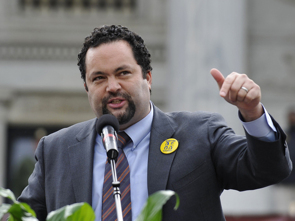 NAACP President Benjamin Jealous hopes that international pressure might be another weapon against strict new voter ID laws. Here Jealous speaks on Jan. 16 at the South Carolina State House in Columbia, S.C., for Martin Luther King Day. 